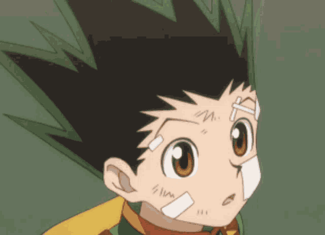 a close up of a cartoon character with a bandage on his forehead