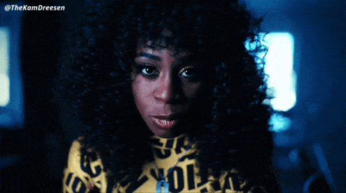 a close up of a woman with the word caution written on it