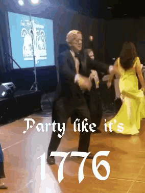 a man in a tuxedo is dancing with a woman in a yellow dress and the words party like it 's 1776