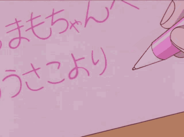 a person is writing on a piece of paper with chinese writing