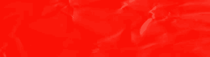 a close up of a red crumpled paper texture .