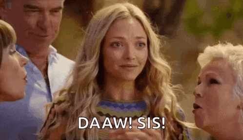 a woman is standing in front of a group of people and saying `` daaw sis '' .