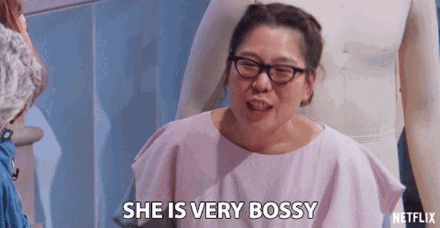 a woman in glasses says she is very bossy