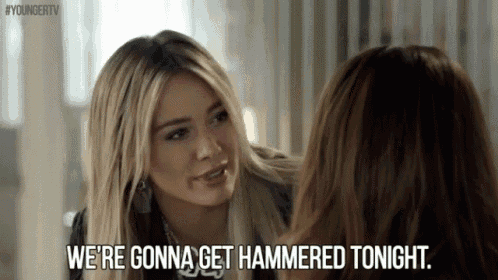 two women are talking to each other and one of them is saying we 're gonna get hammered tonight