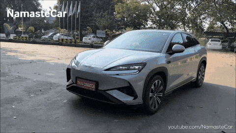 a silver car with a license plate that says tk14 2060tcr