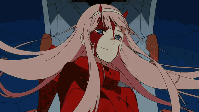 a girl with pink hair and horns is wearing a red shirt