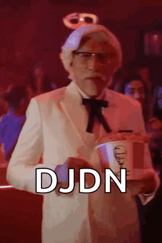 a man dressed as kentucky fried chicken is holding a cup of kfc chicken .