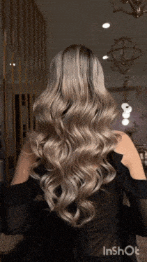 a woman 's hair is shown in a video taken by inshot