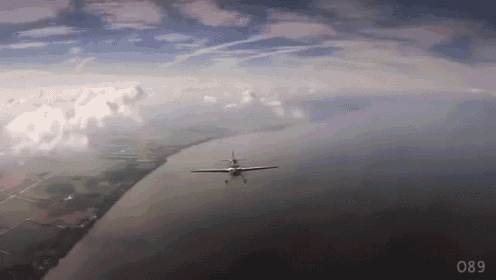 a plane flying over a body of water with the number 089 on the bottom right