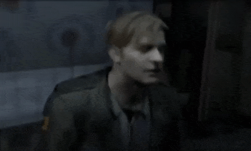 a man in a police uniform is standing in a dark room with his head up .