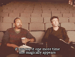 two men are sitting in a theater and one of them says if you say it one more time she magically appears