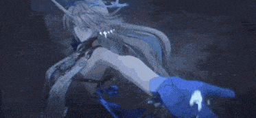 a girl with long hair and a crown on her head is holding a blue object in her hand .