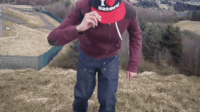 a man wearing a hat that says i hate haters on it