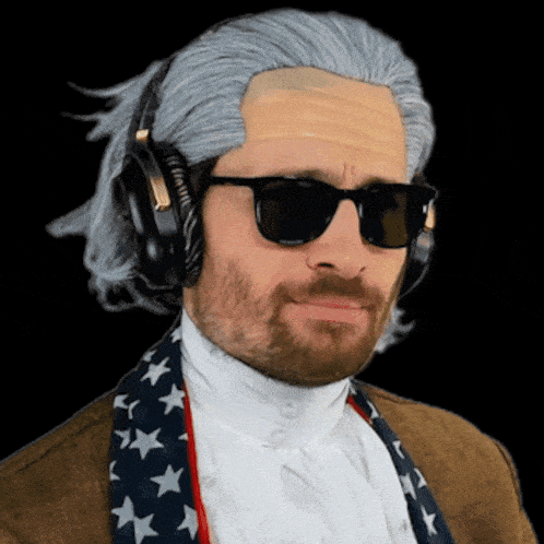 a man wearing a wig and sunglasses is wearing headphones and an american flag scarf