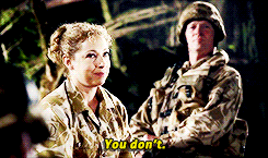 a woman in a military uniform is talking to a man in a military uniform who says you don 't