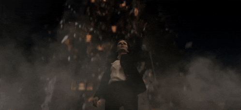 a blurred image of a person walking in the dark