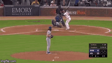 a baseball game is being played in a stadium with ads for state farm ford and georgia power
