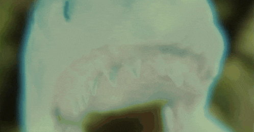 a blurry picture of a blue object with a green background .