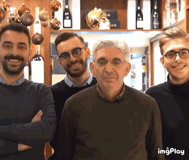 a group of men posing for a picture with a watermark that reads imgplay