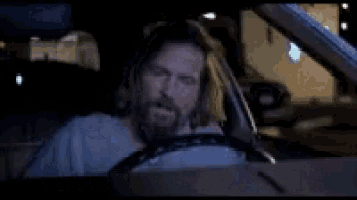 a man is driving a car with the words you 're not wrong written on the screen .