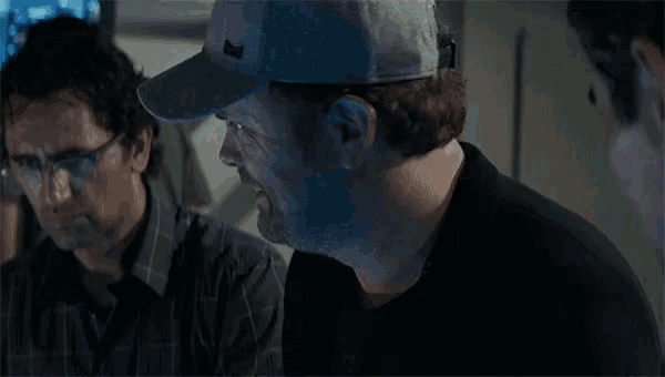 two men are standing next to each other and one of them is saying `` he 's kidding right '' .