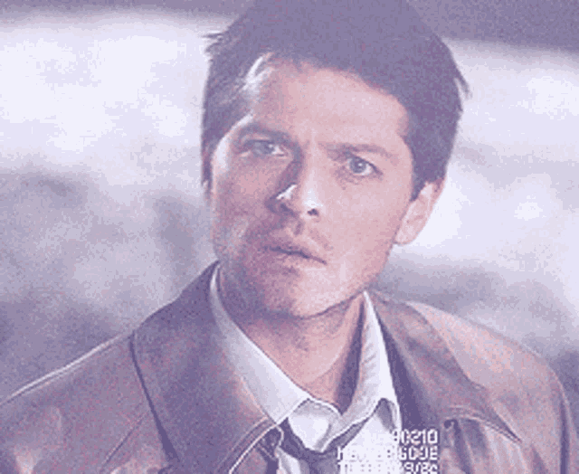 a close up of a man 's face with the number 90210 visible
