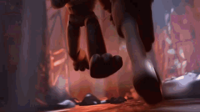 a close up of a cartoon character 's feet walking down a dark path .