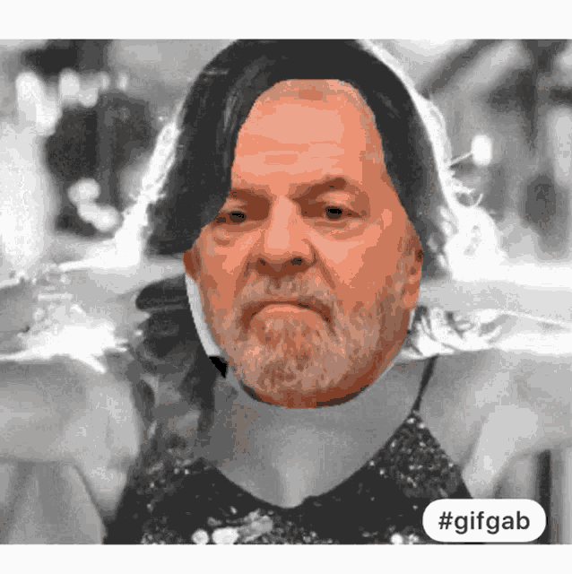a gif of a man with long hair and a beard with #gifgab at the bottom