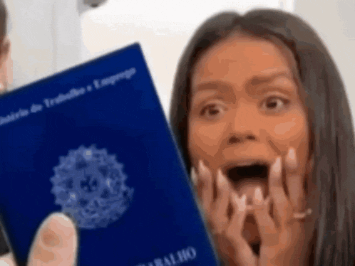 a woman is holding a passport that says trabalho