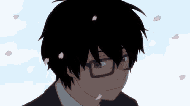 a close up of a person 's face with petals falling from his hair