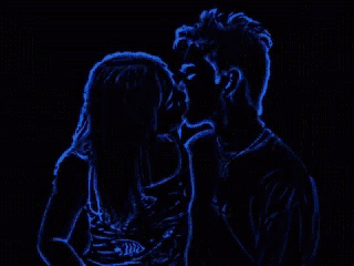 a man and a woman are kissing in a neon green drawing on a black background .