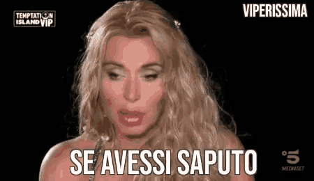 a woman with blonde hair is talking on a television show .