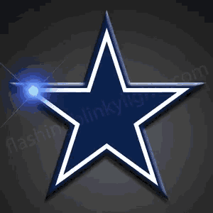 a blue and white cowboys star with a light coming out of the top