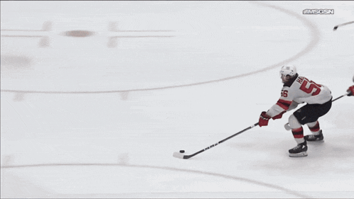 a hockey player with the number 58 on his shirt