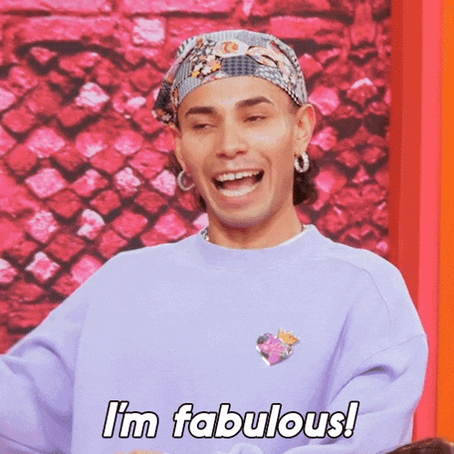 a man wearing a purple sweatshirt and a bandana is laughing and saying i 'm fabulous .
