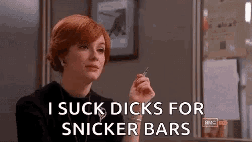 a woman with red hair is holding a cigarette in her hand and says `` i suck dicks for snicker bars '' .