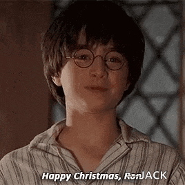 harry potter is wearing glasses and a striped shirt and says `` happy christmas , ronjack '' .