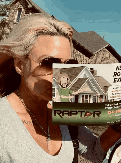 a woman is holding a raptor roofing advertisement