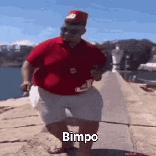 a fat man in a red shirt and white shorts is dancing and the word bimbo is visible