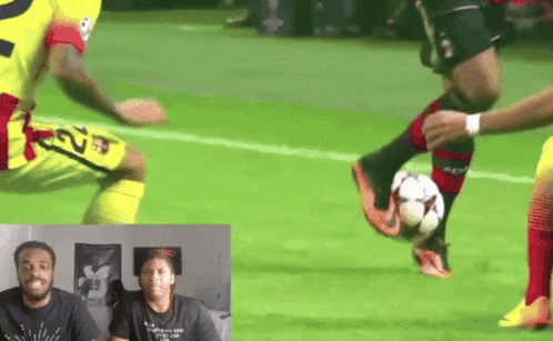 a soccer player with the number 69 on his shorts kicks a ball