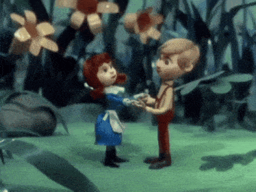 a boy and a girl are standing next to each other and holding hands