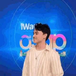 a man in a striped shirt is standing in front of a sign that says war app .