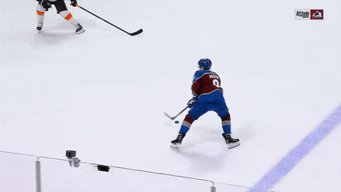 a hockey game is being played in front of a pepsi advertisement