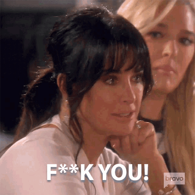 a woman with a ponytail and bangs says f ** k you