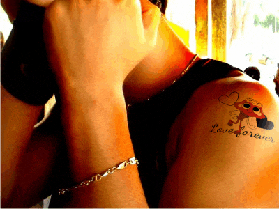 a person with a tattoo that says love forever