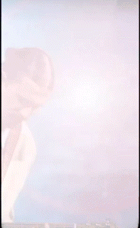 a man is playing a guitar in front of a blue background