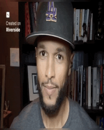 a man wearing a hat with la on it
