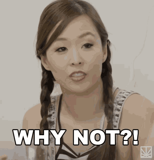 a woman with pigtails says why not in white letters