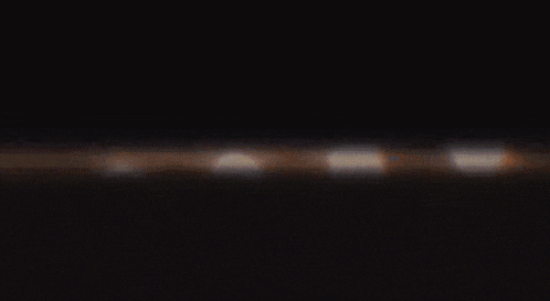 a close up of a row of lights in the dark