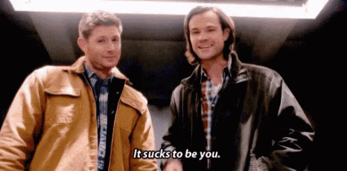 two men are standing next to each other in an elevator and one of them is saying it sucks to be you .